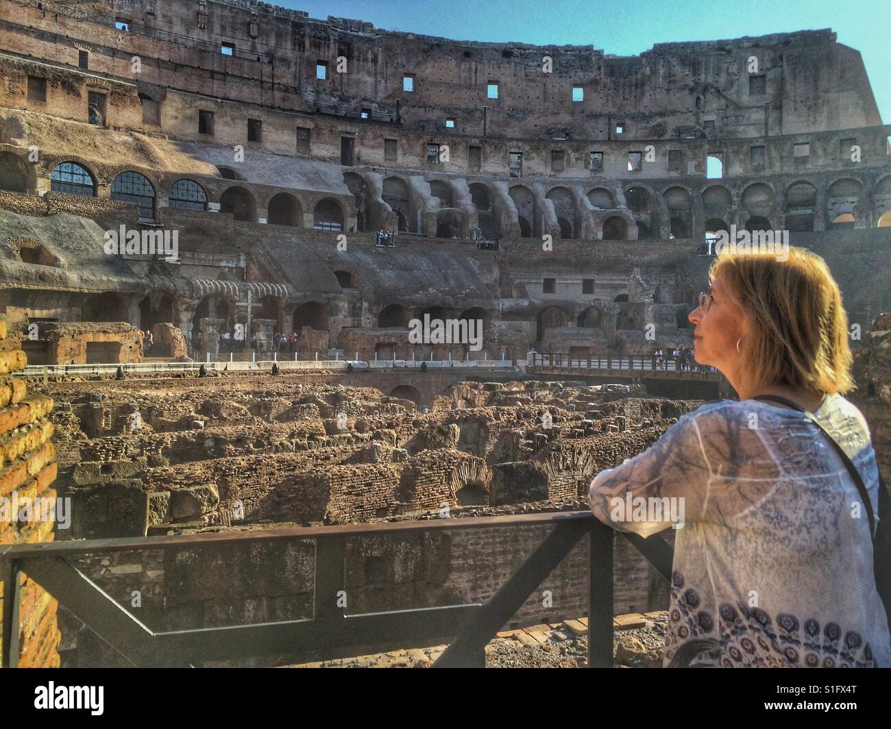 Woman visiting the coliseum in Rome, Italy Stock Photo