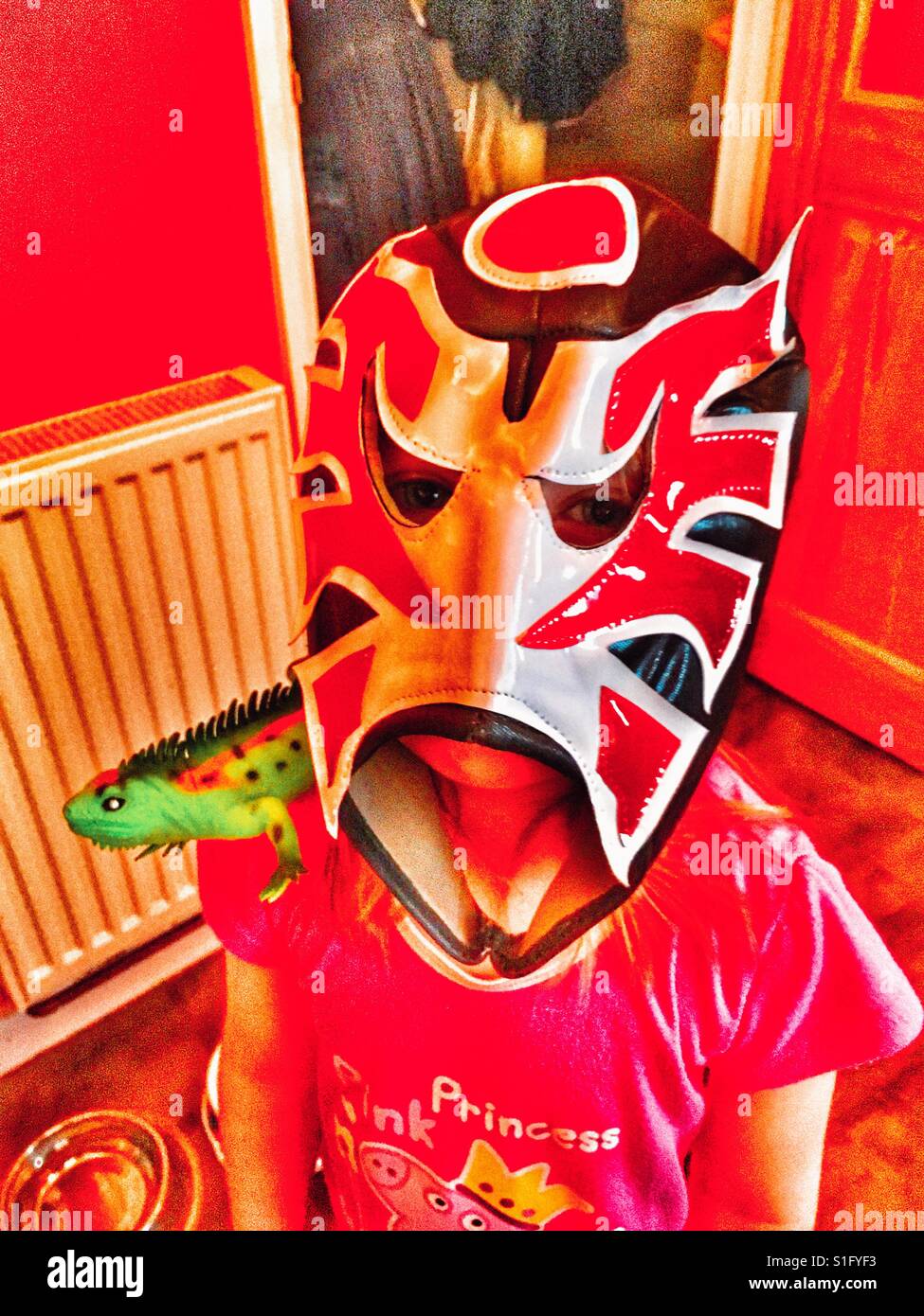 Little girl in Mexican Wrestling Mask. Stock Photo