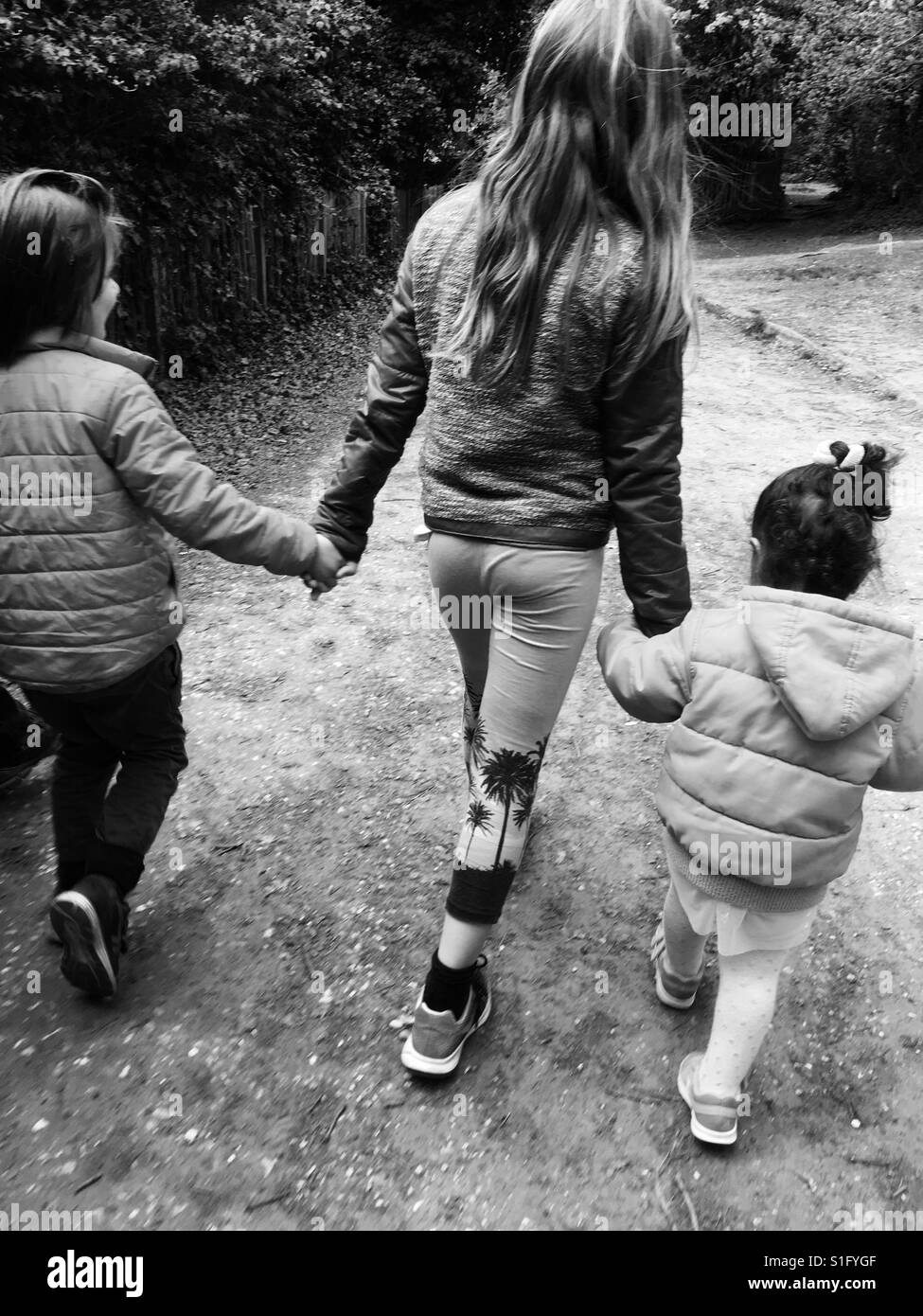 black and white kids holding hands