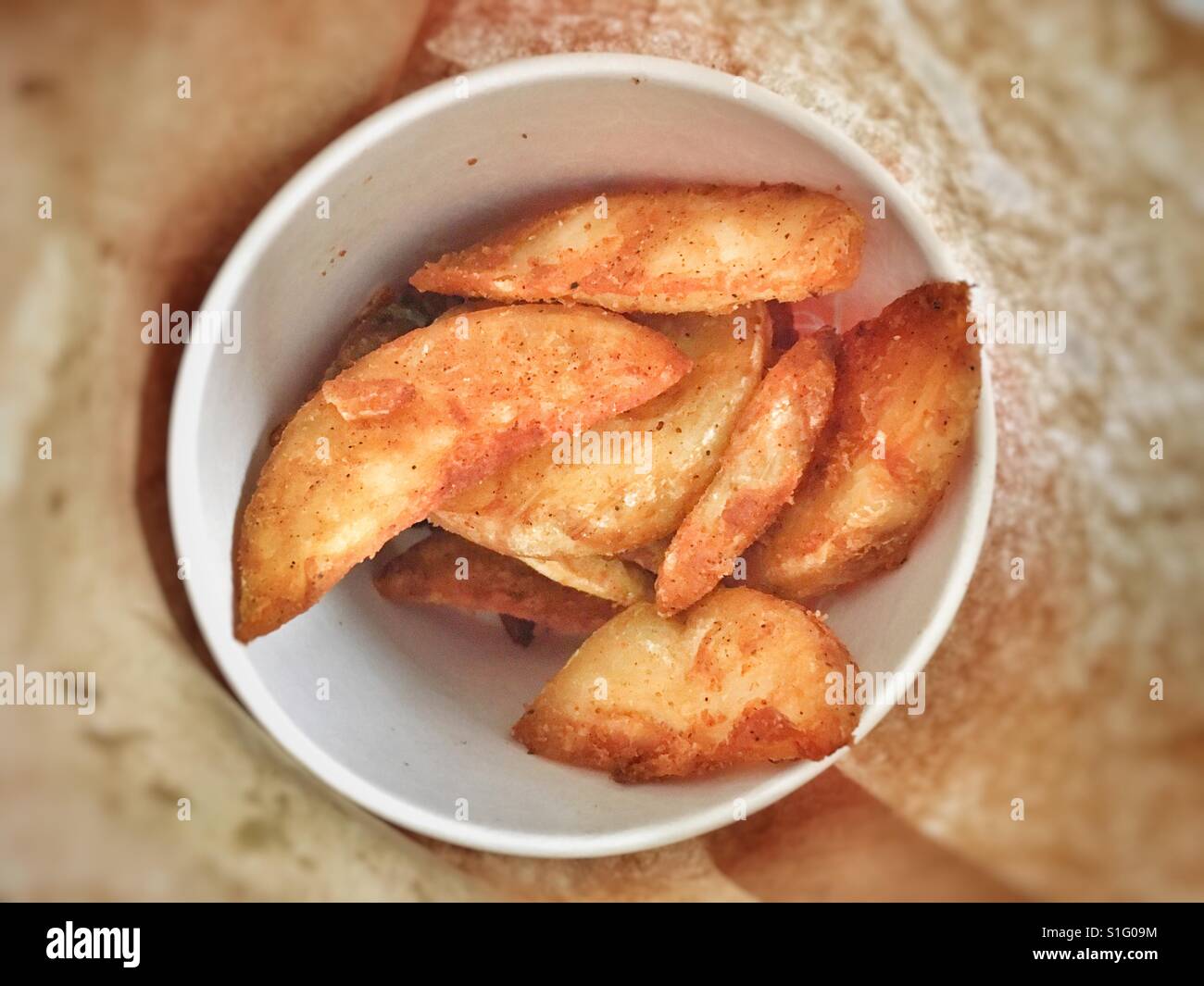 Cup of wedges in a brown paper bag Stock Photo Alamy