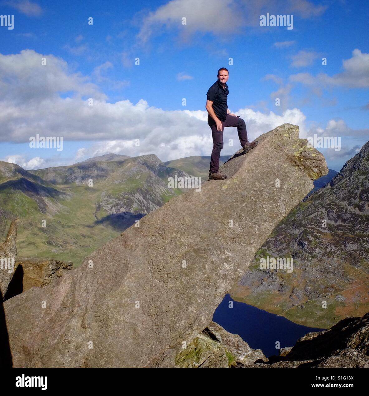 Climber on the Cannon Stone, Tryfan Mountain, Snowdonia, Wales. - Smartphone Captured Stock Image