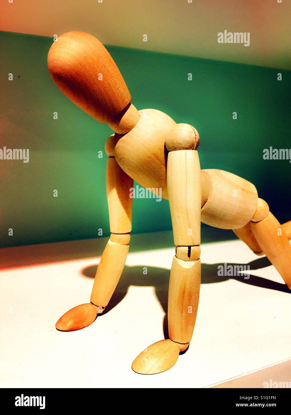 Wooden mannequin used to teach body proportion to Artists - Smartphone Captured Stock Image