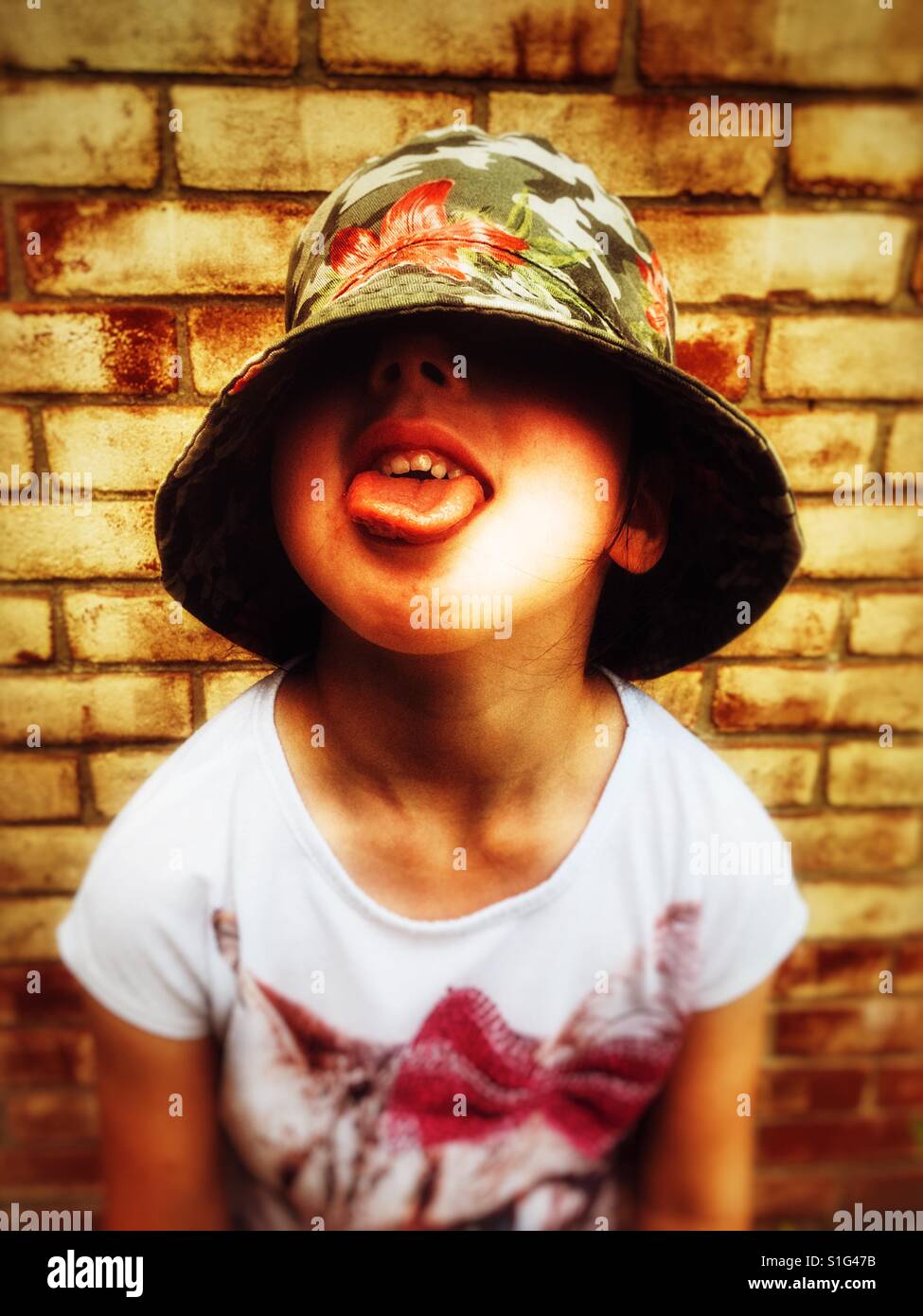 Child sticking tongue out Stock Photo Alamy
