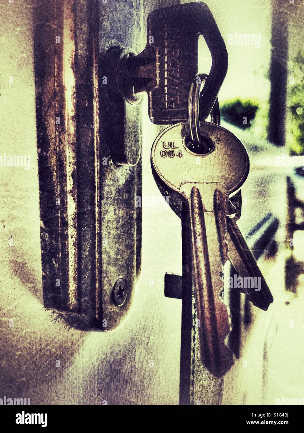 Bunch of keys in the lock of a front door - Smartphone Captured Stock Image