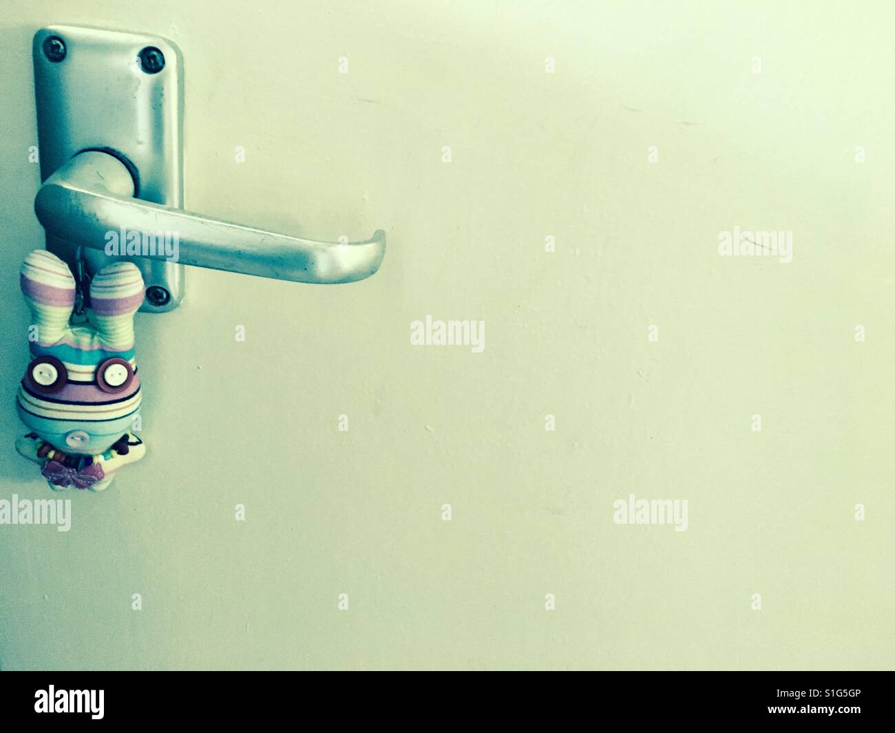 Door knob and an old toy from Bangkok - Smartphone Captured Stock Image