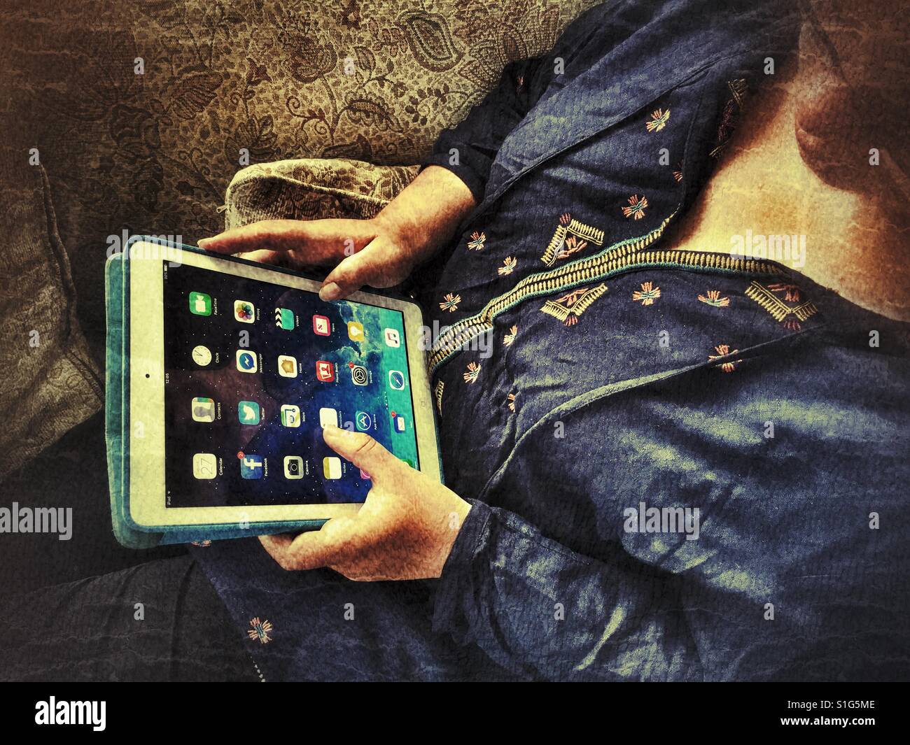 Millennial using an iPad - Smartphone Captured Stock Image