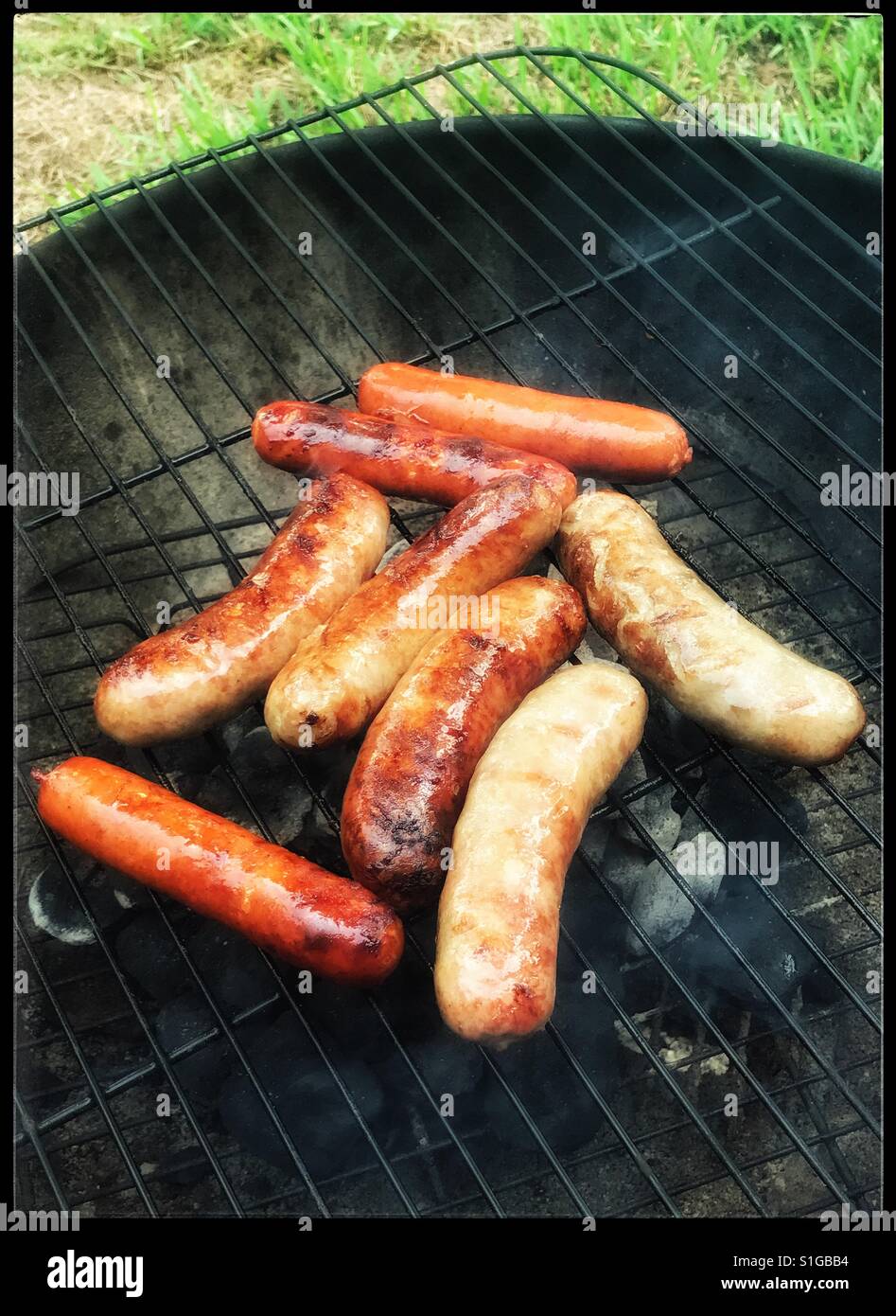 Sausages on the back yard barbecue - Smartphone Captured Stock Image