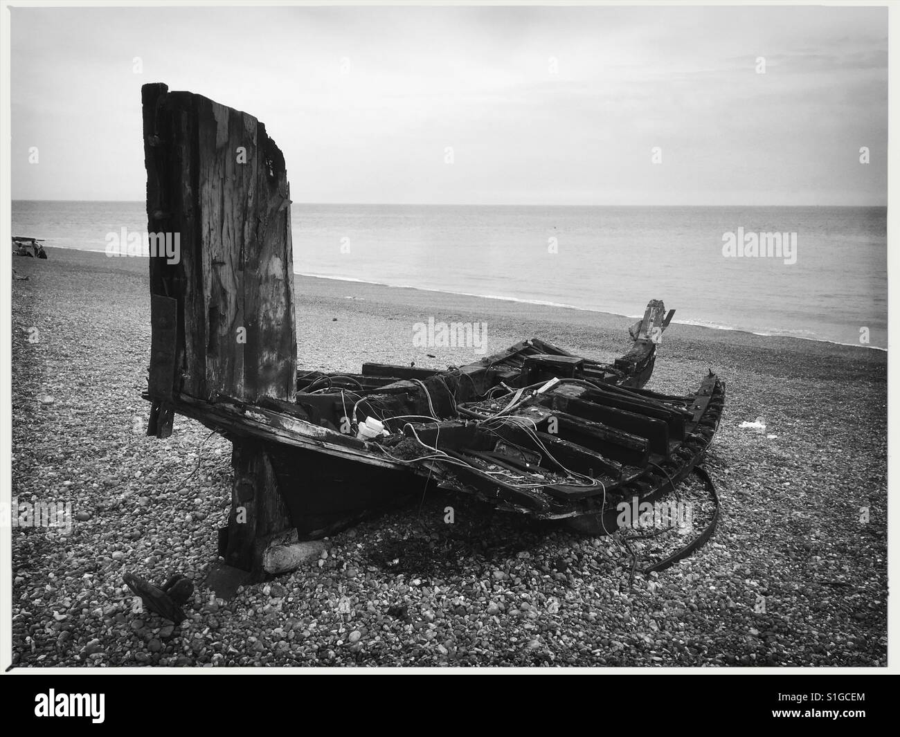 Boat wreck on beach in Hastings England Stock Photo