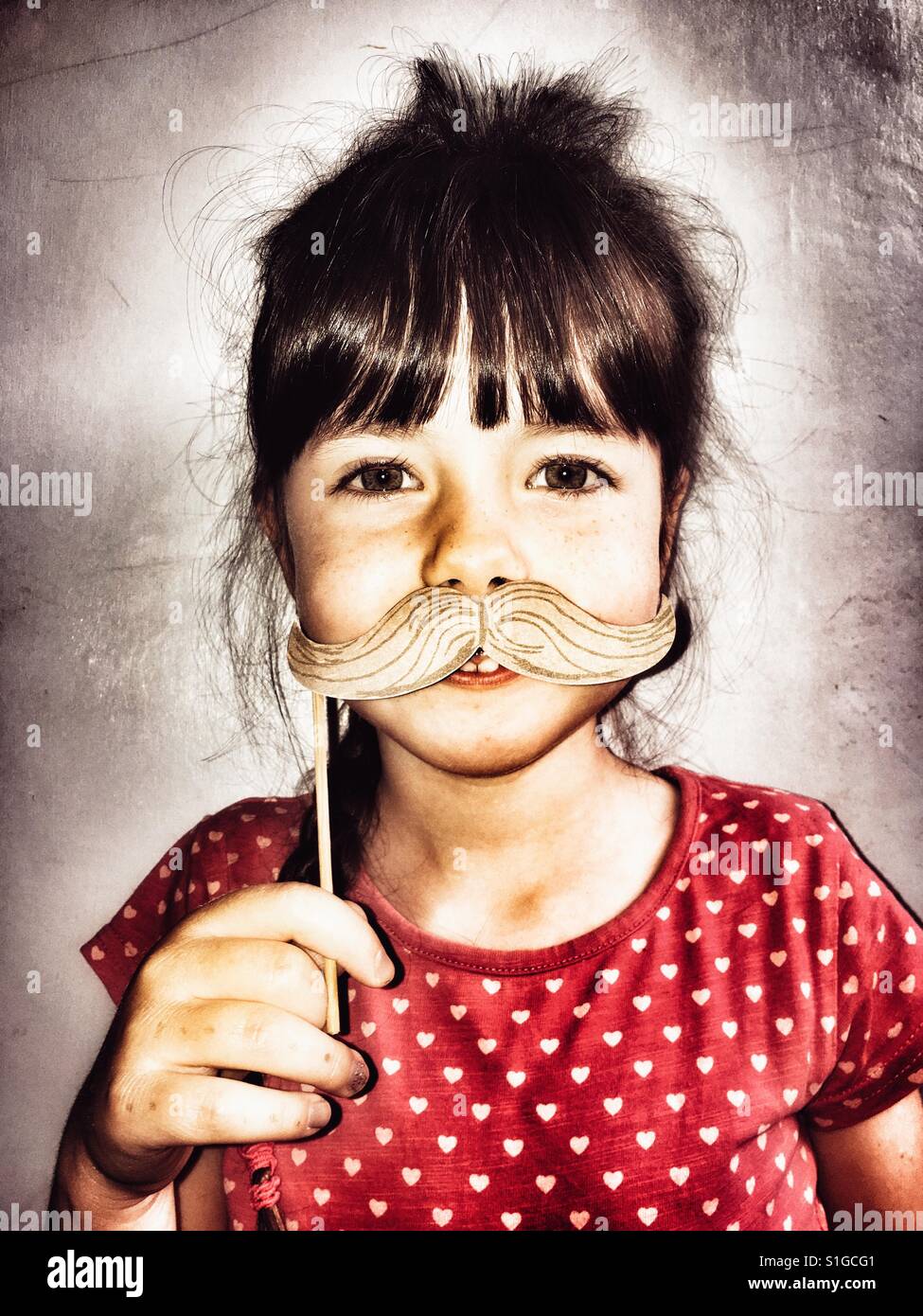 Girl with comedy moustache - Smartphone Captured Stock Image