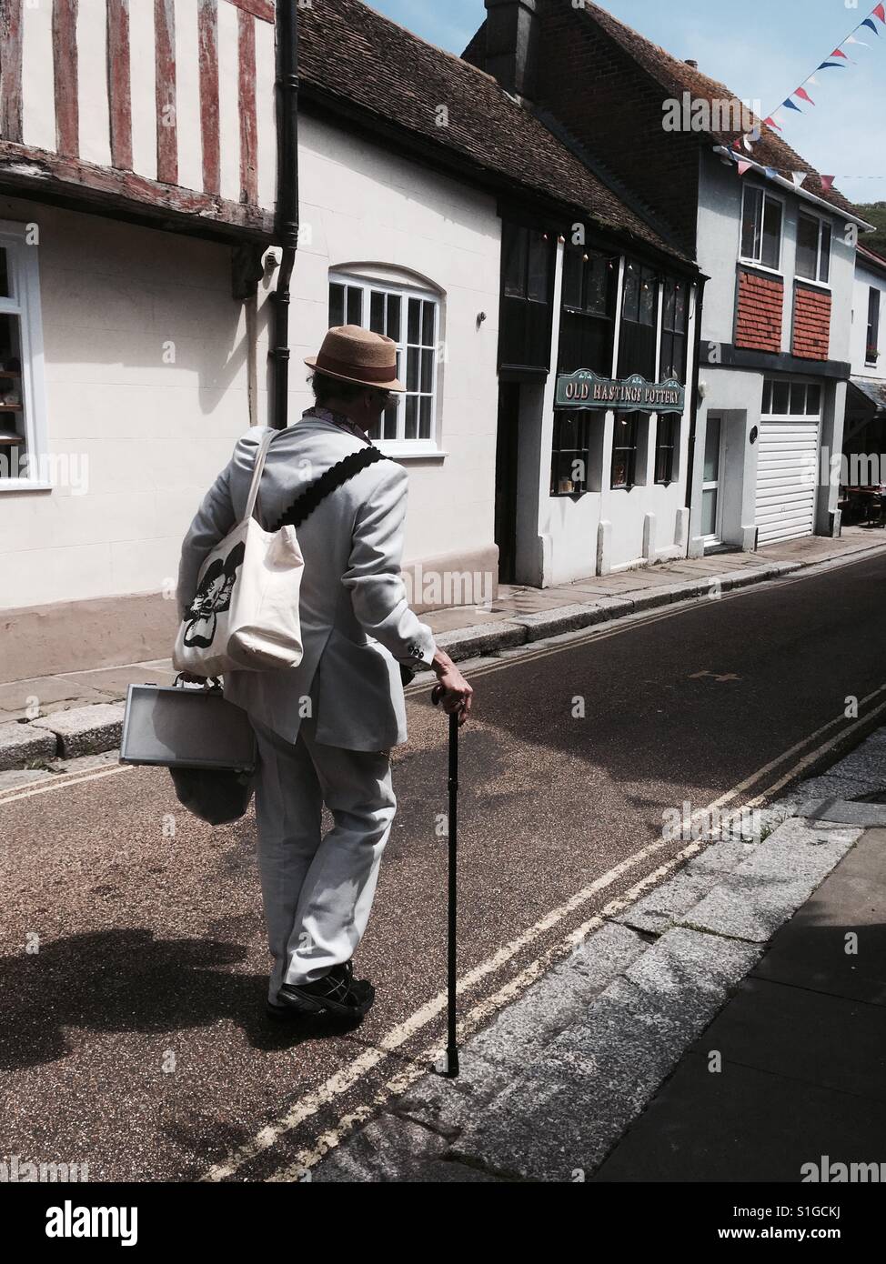 Man walking in old town in Hastings East Sussex England United Kingdom - Smartphone Captured Stock Image