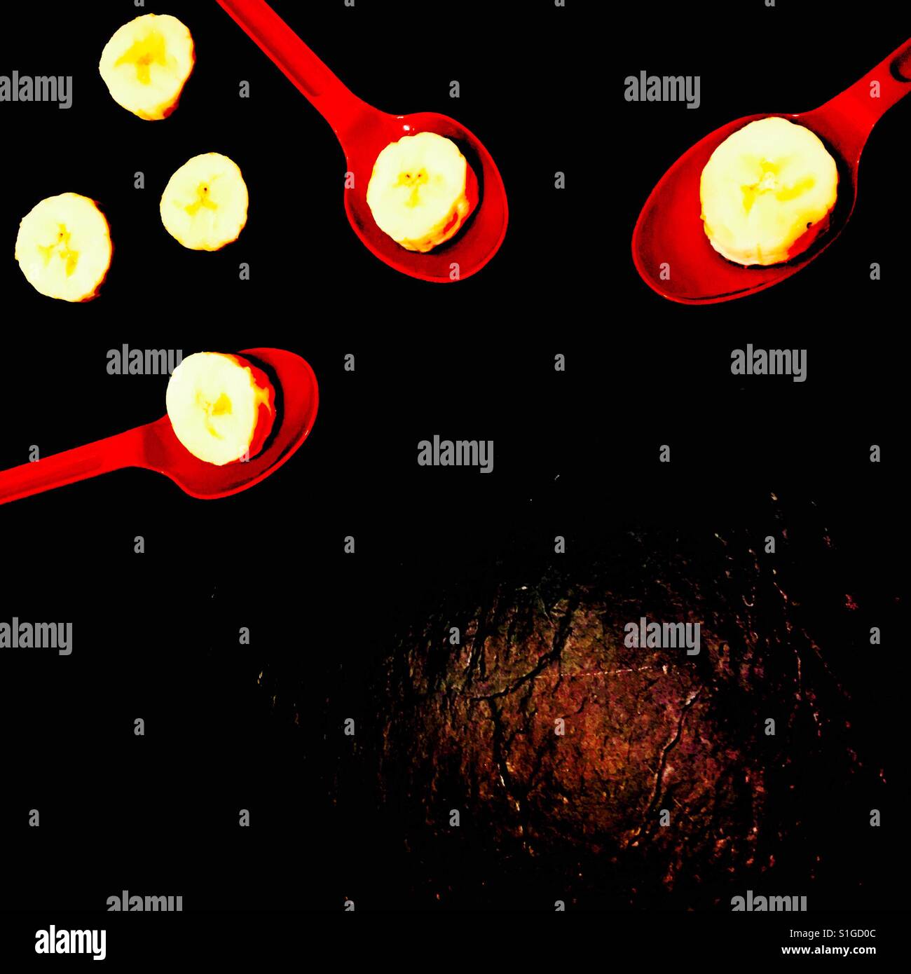 Three red spoons and banana slices - Smartphone Captured Stock Image