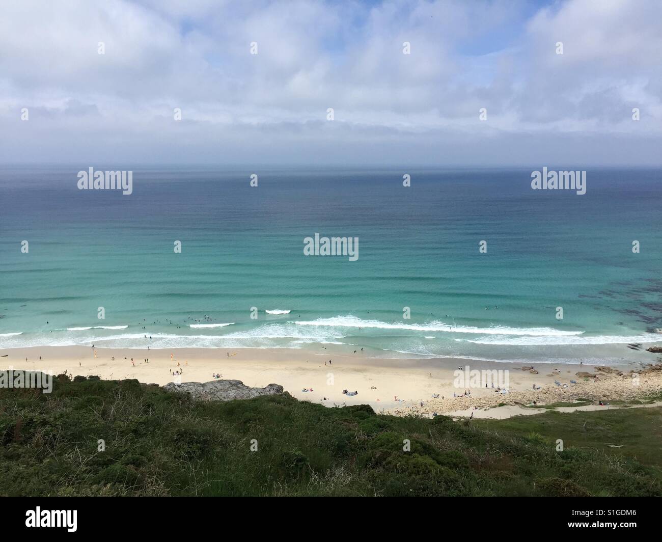 People enjoy the weather on the beach at Gwynver near Sennen in Cornwall, UK. Stock Photo