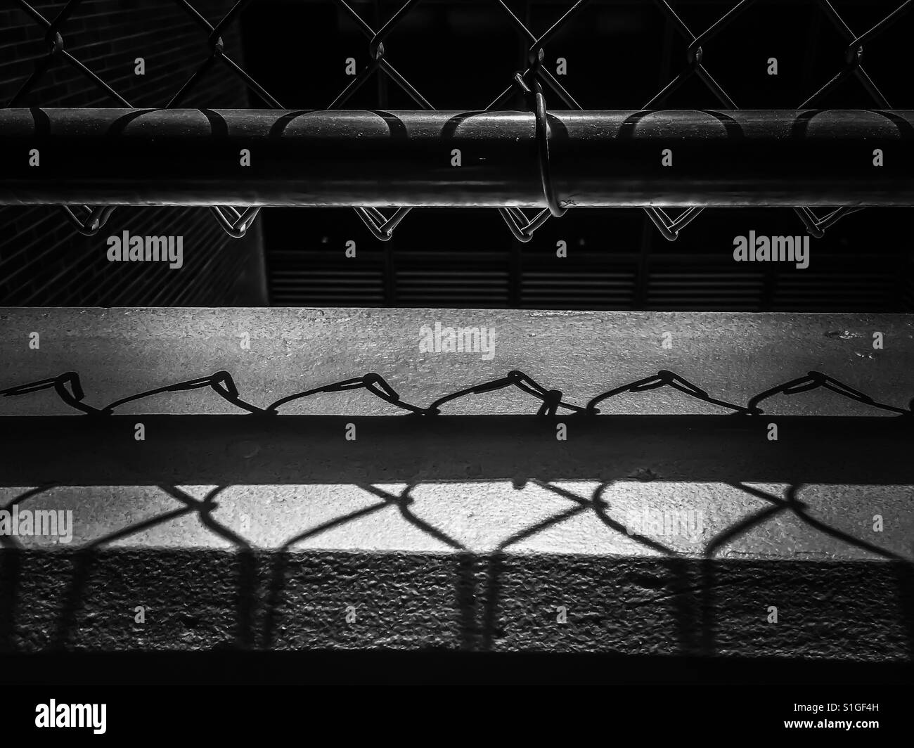 Chain Link Fence Shadows Stock Photo Alamy