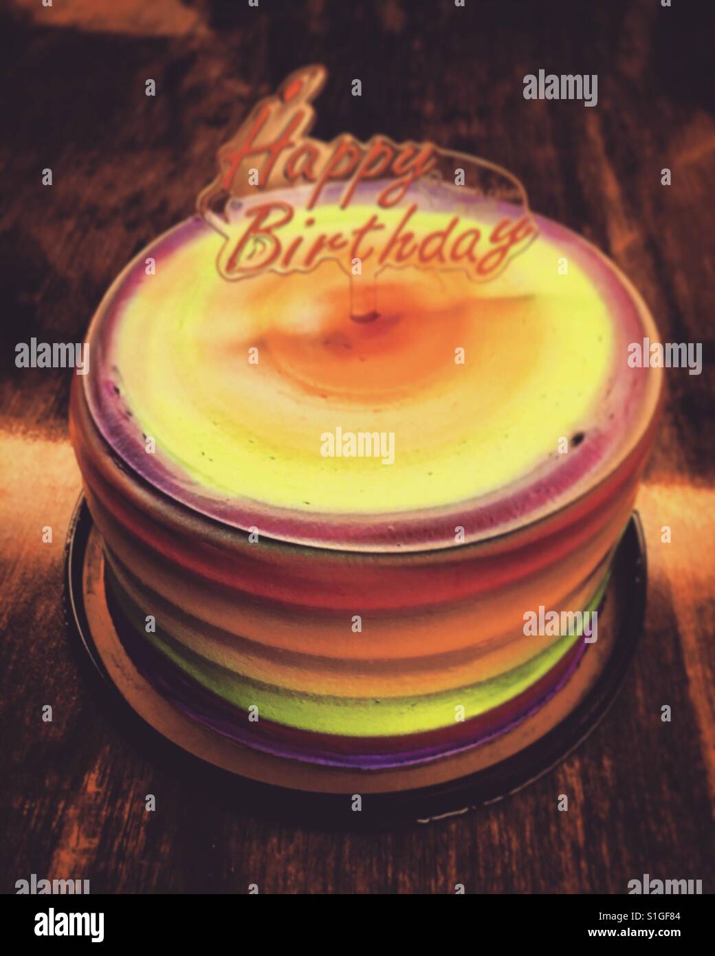 round cake in rainbow color for birthday - Smartphone Captured Stock Image