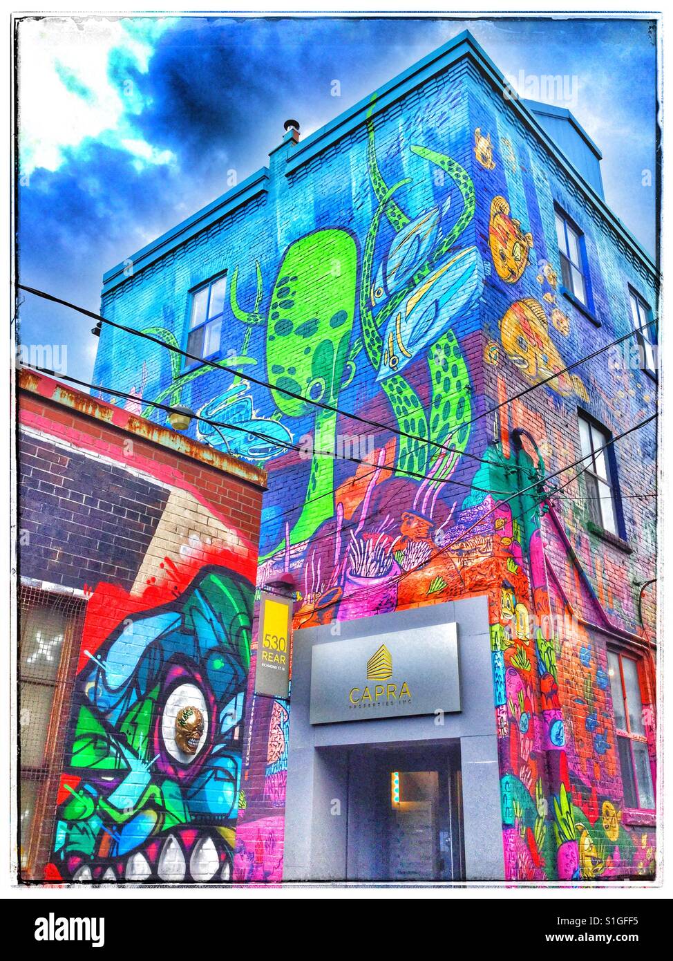 Brightly painted building wall in a Toronto neighbourhood. - Smartphone Captured Stock Image