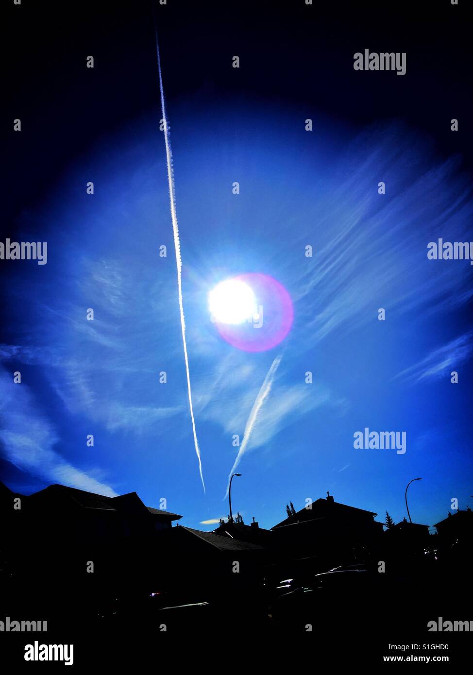 Sun spots and jet trails - Smartphone Captured Stock Image