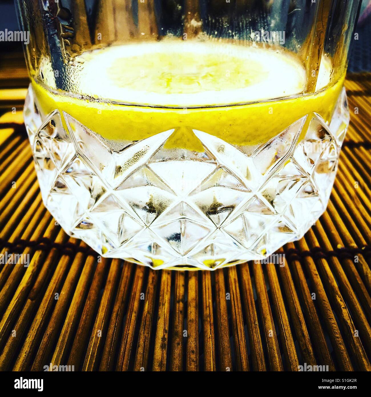 A gin and tonic drink with a slice of lemon - Smartphone Captured Stock Image