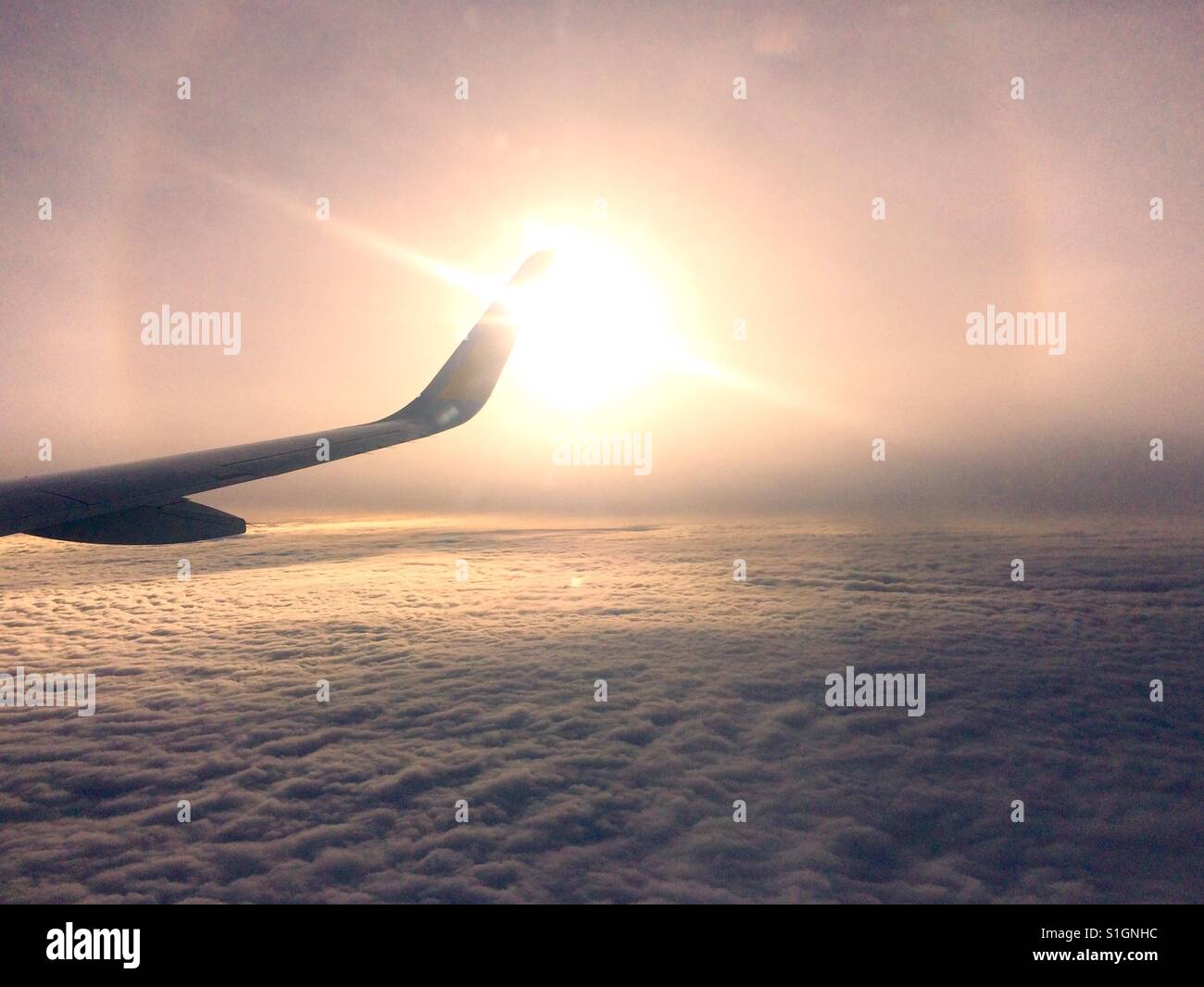 Wing of a airplane above the clouds Stock Photo - Alamy