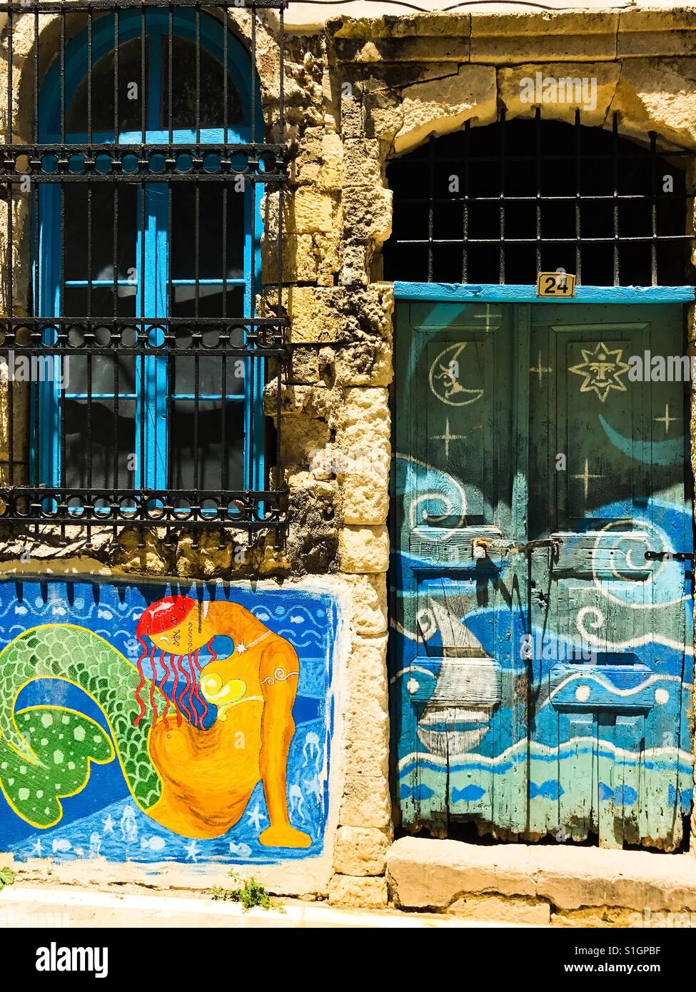 Painted doors in medieval quarter Rethymno Crete Stock Photo