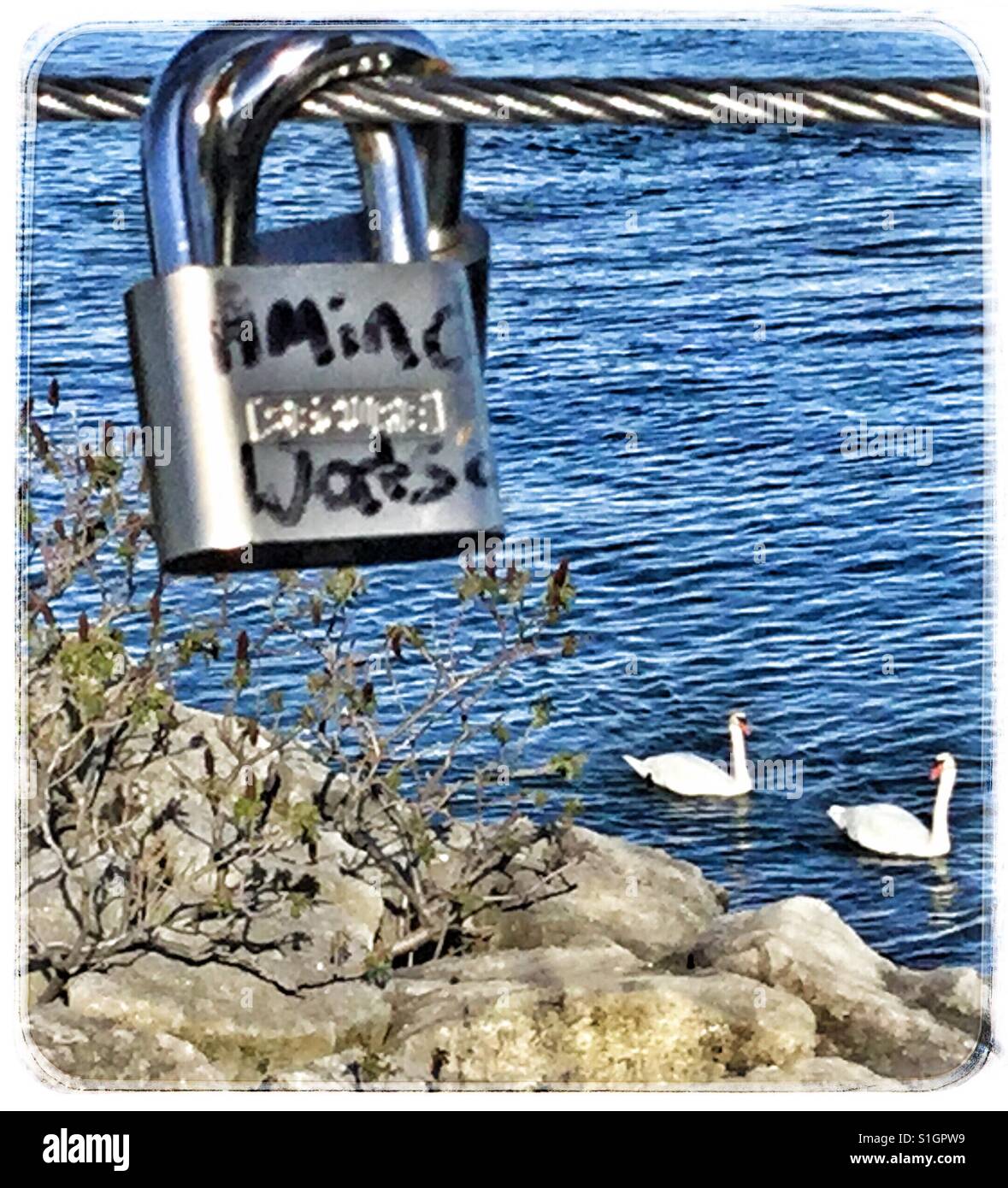 A love lock hanging on the Humber Bay bridge in Toronto waterfront. - Smartphone Captured Stock Image