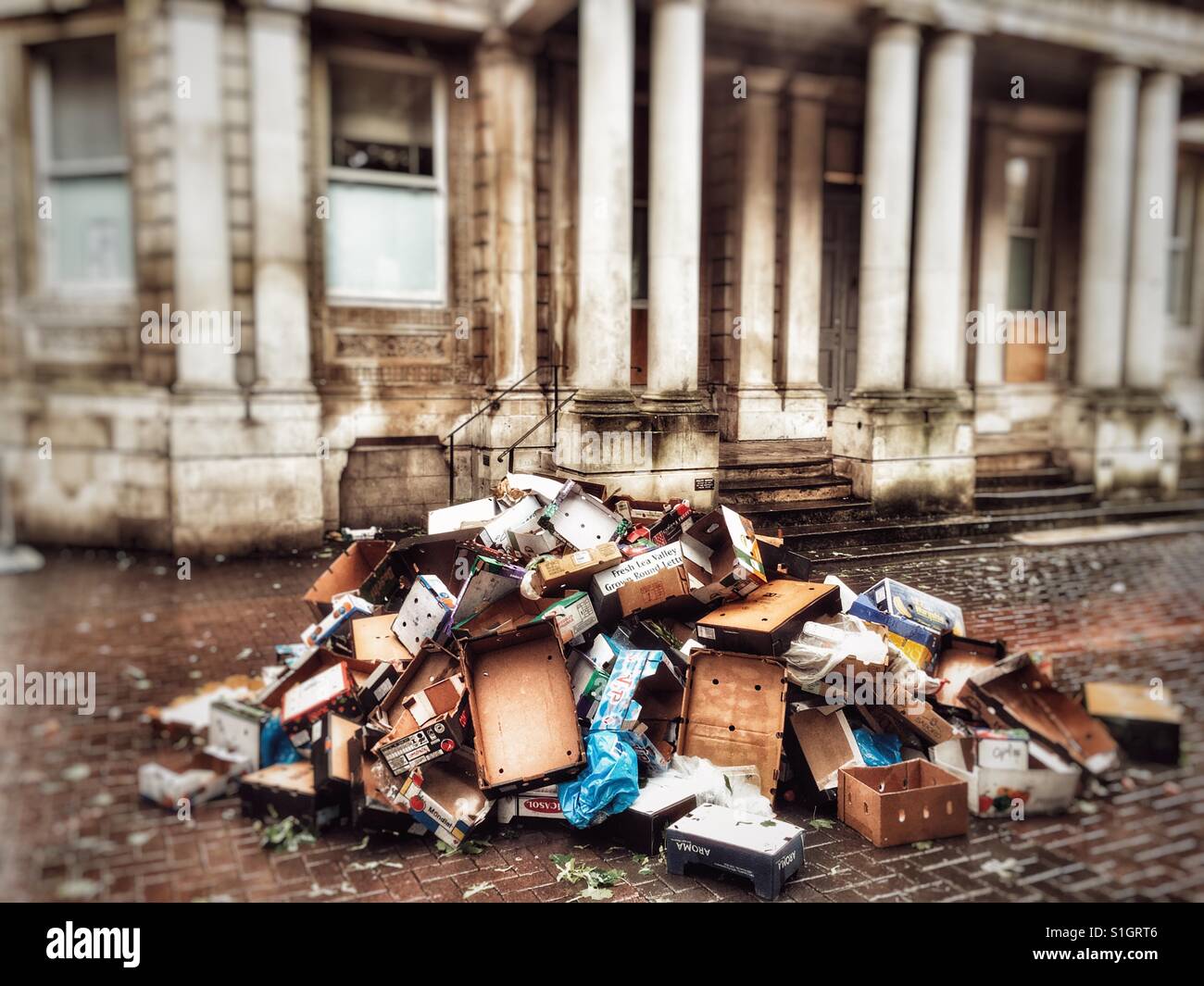 Pile of cardboard boxes left over from market Day, Ipswich, Suffolk, UK. - Smartphone Captured Stock Image
