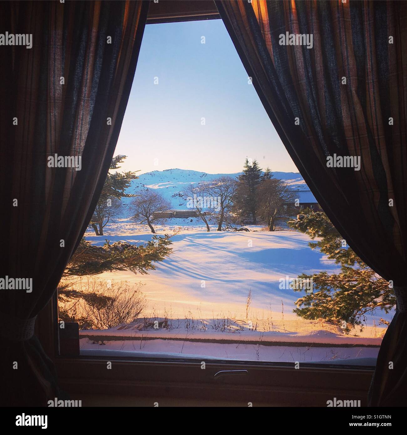 Winter scene through window Stock Photo - Alamy