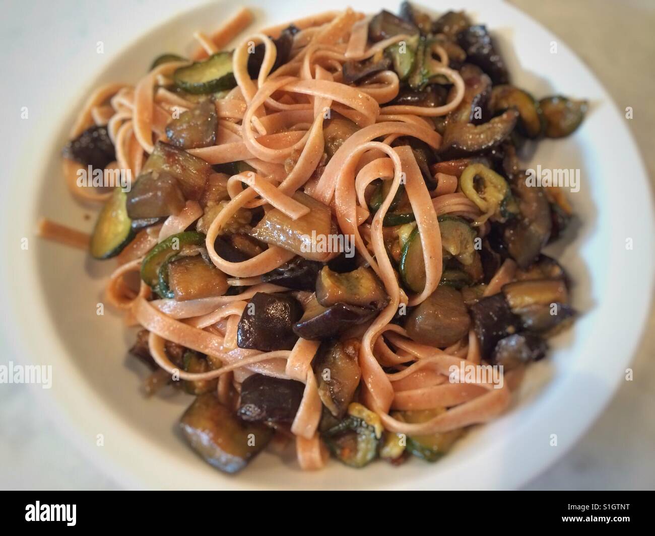 Spelt fettuccine with zucchini, aubergine and paprika. - Smartphone Captured Stock Image