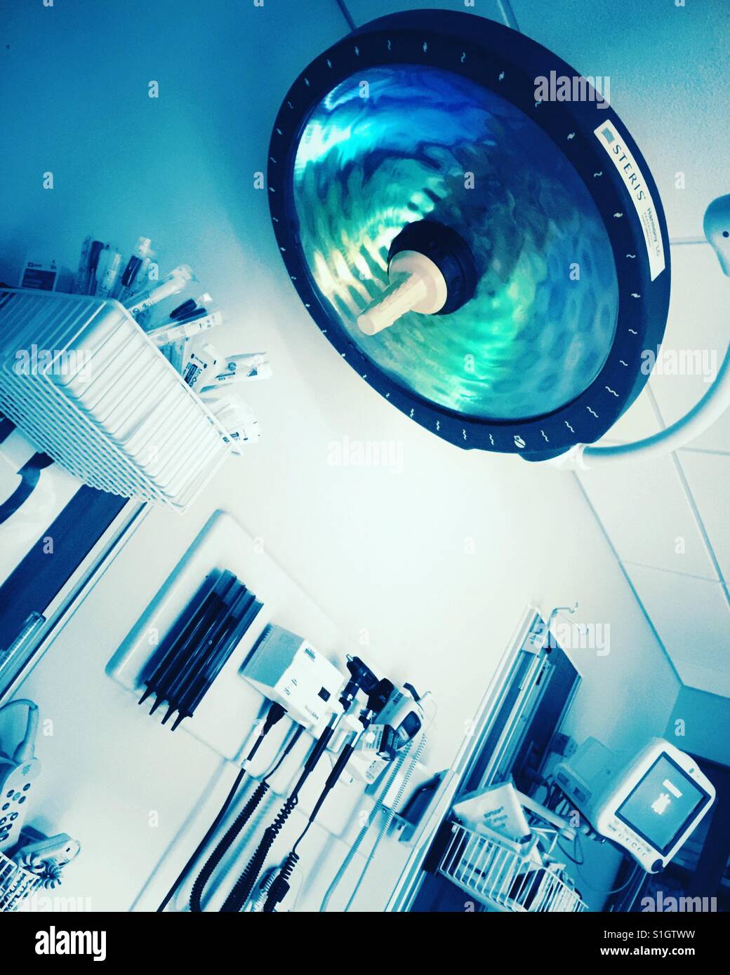 A large light and medical equipment in a hospital emergency room. - Smartphone Captured Stock Image