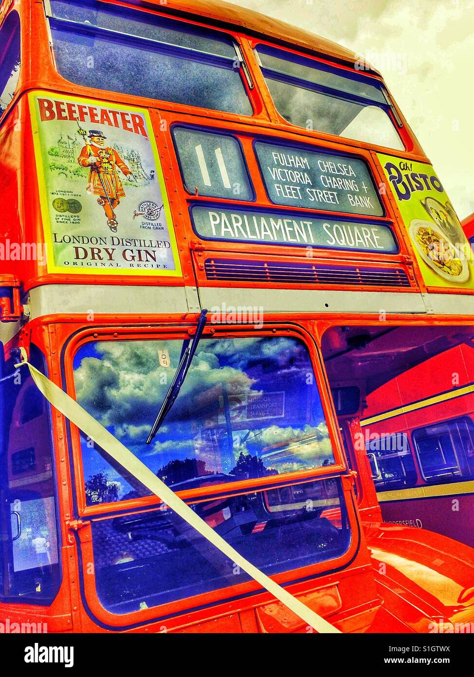 Original London red double decker routemaster bus decorated with ribbon for wedding - Smartphone Captured Stock Image