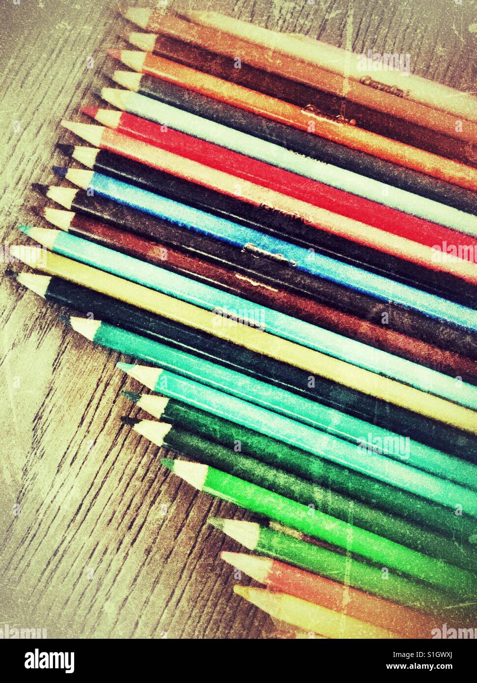 Pencil crayons in a row. Stock Photo