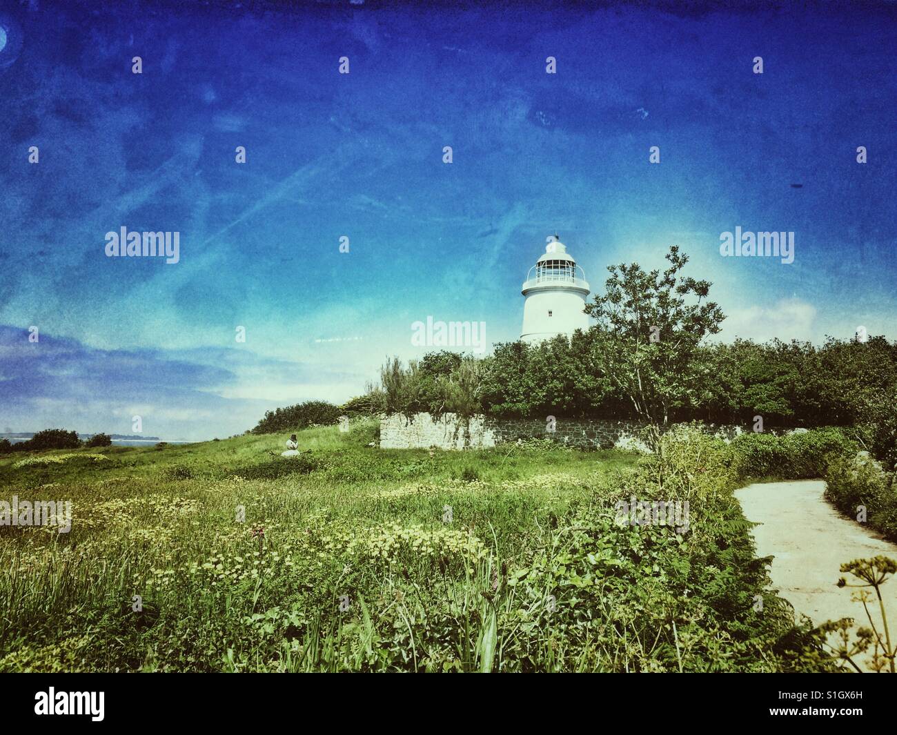 The lighthouse on St Agnes, an inhabited island of the Isles of Scilly archipelago - Smartphone Captured Stock Image