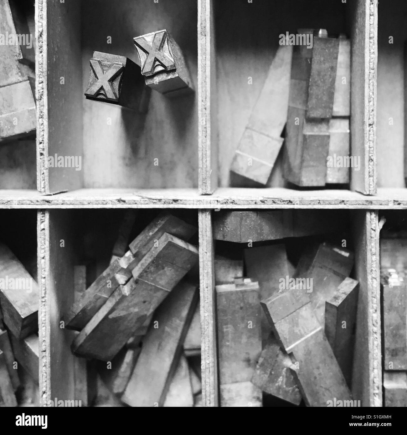 Two letterpress Xs in a box - Smartphone Captured Stock Image