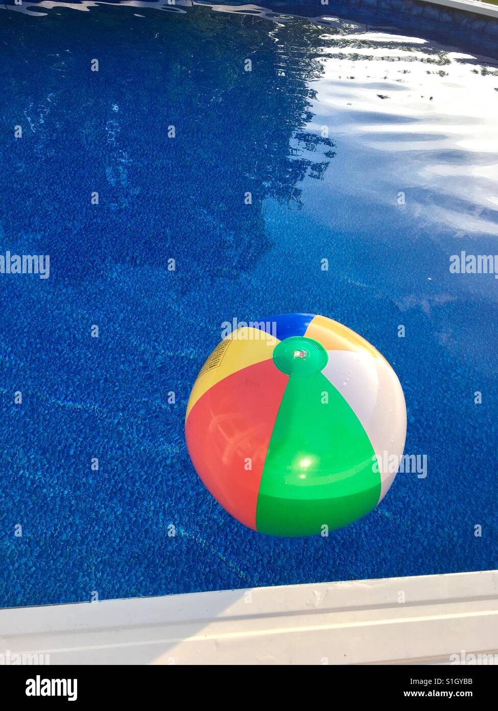 Beach Ball Floats in Pool Stock Photo Alamy