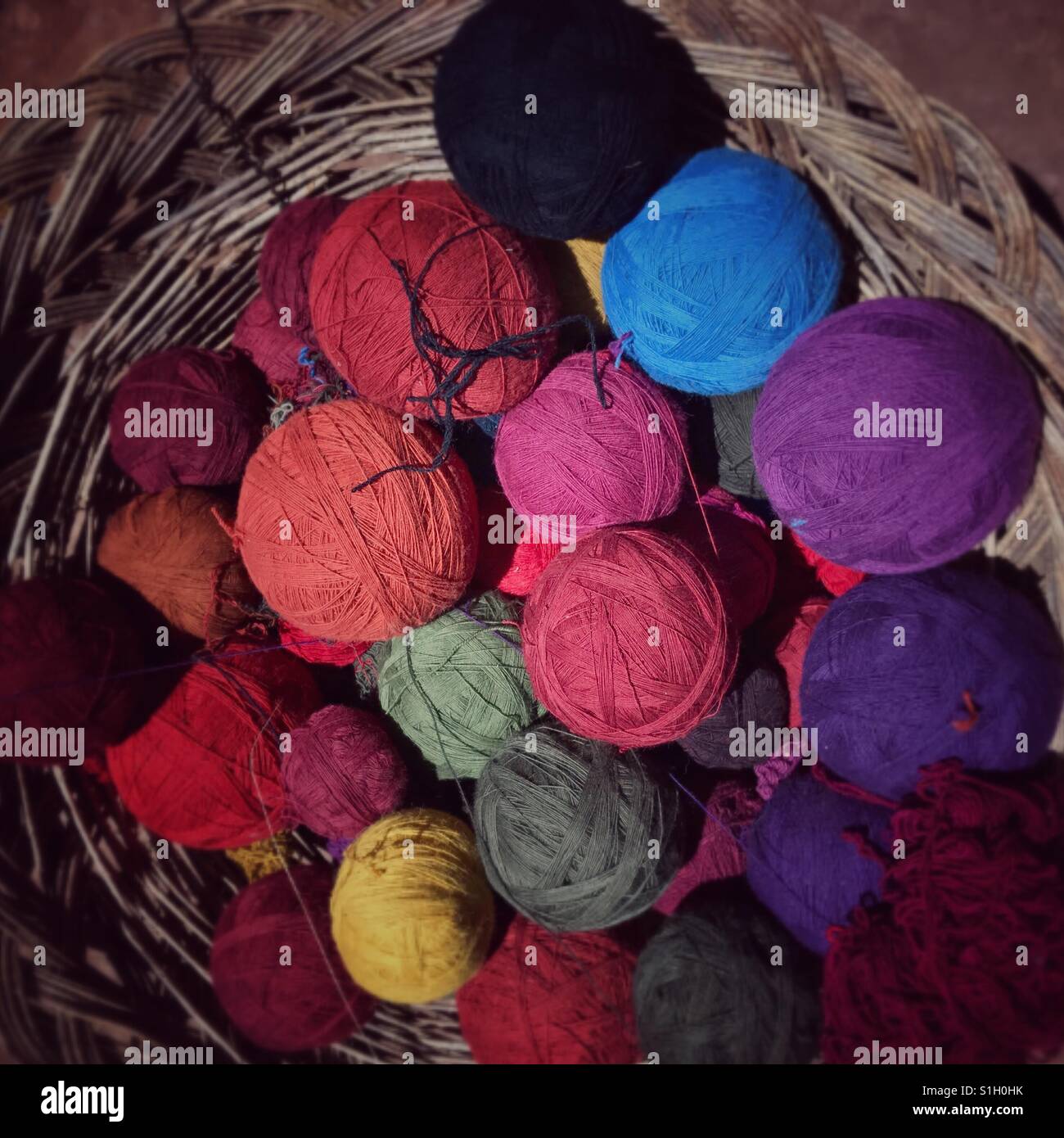 Balls of yarn made from alpaca wool and colored with natural dyes like cochineal Stock Photo