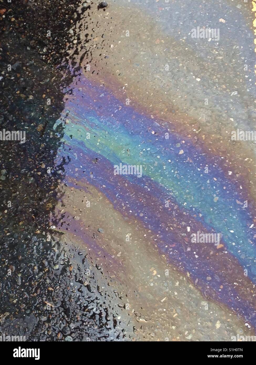 Gasoline and rain create a rainbow Stock Photo