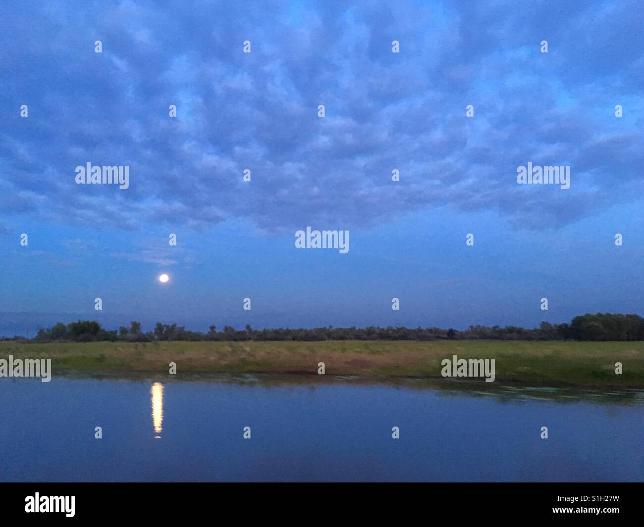 Full moon over Corroboree Billabong, near Darwin in the Northern Territory of Australia. - Smartphone Captured Stock Image