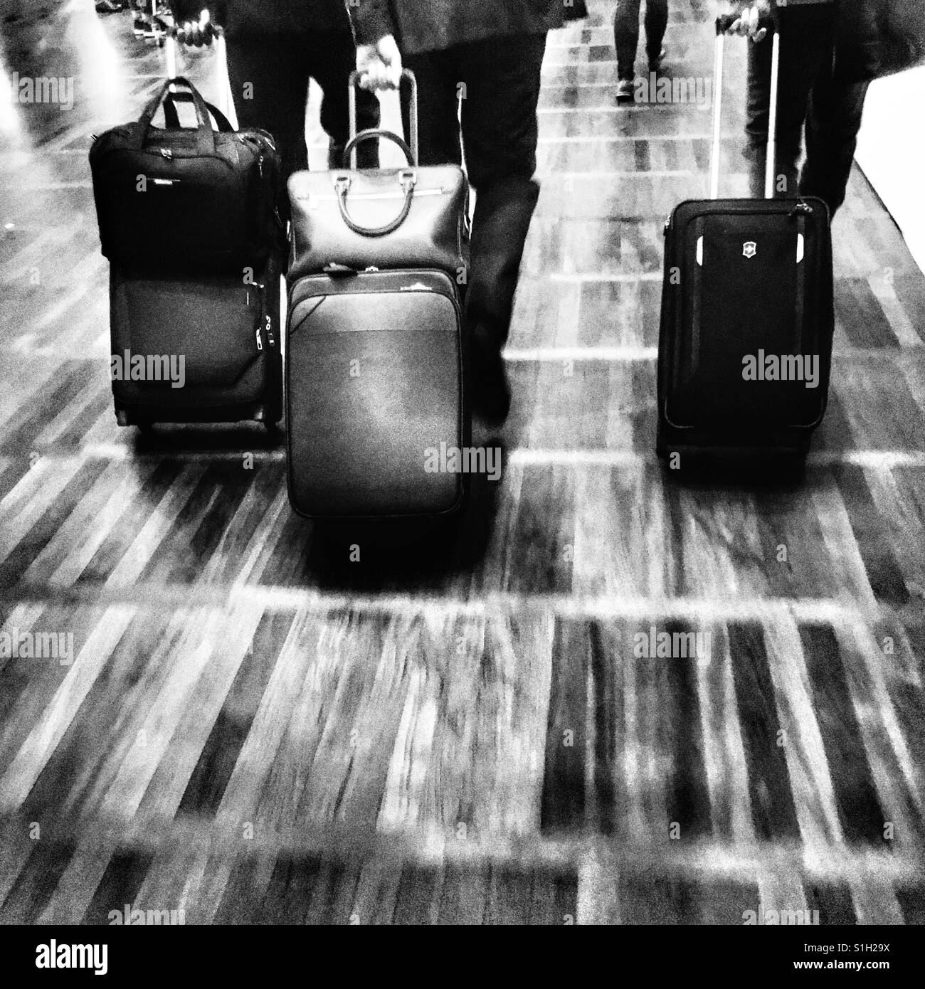 Business travellers departing at an airport Stock Photo