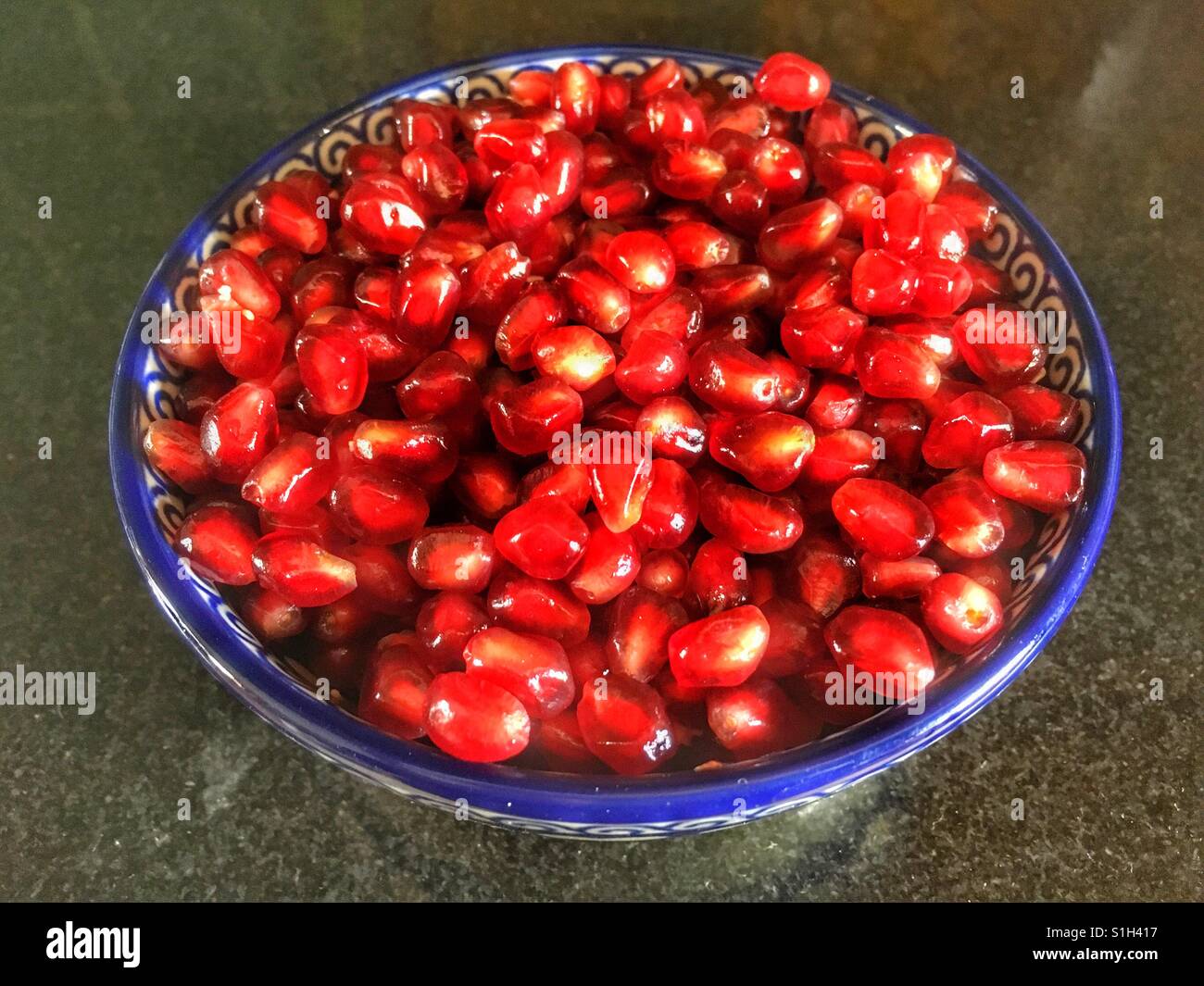 A bowl of Pomegranate arils (seeds), Punica granatum - Smartphone Captured Stock Image