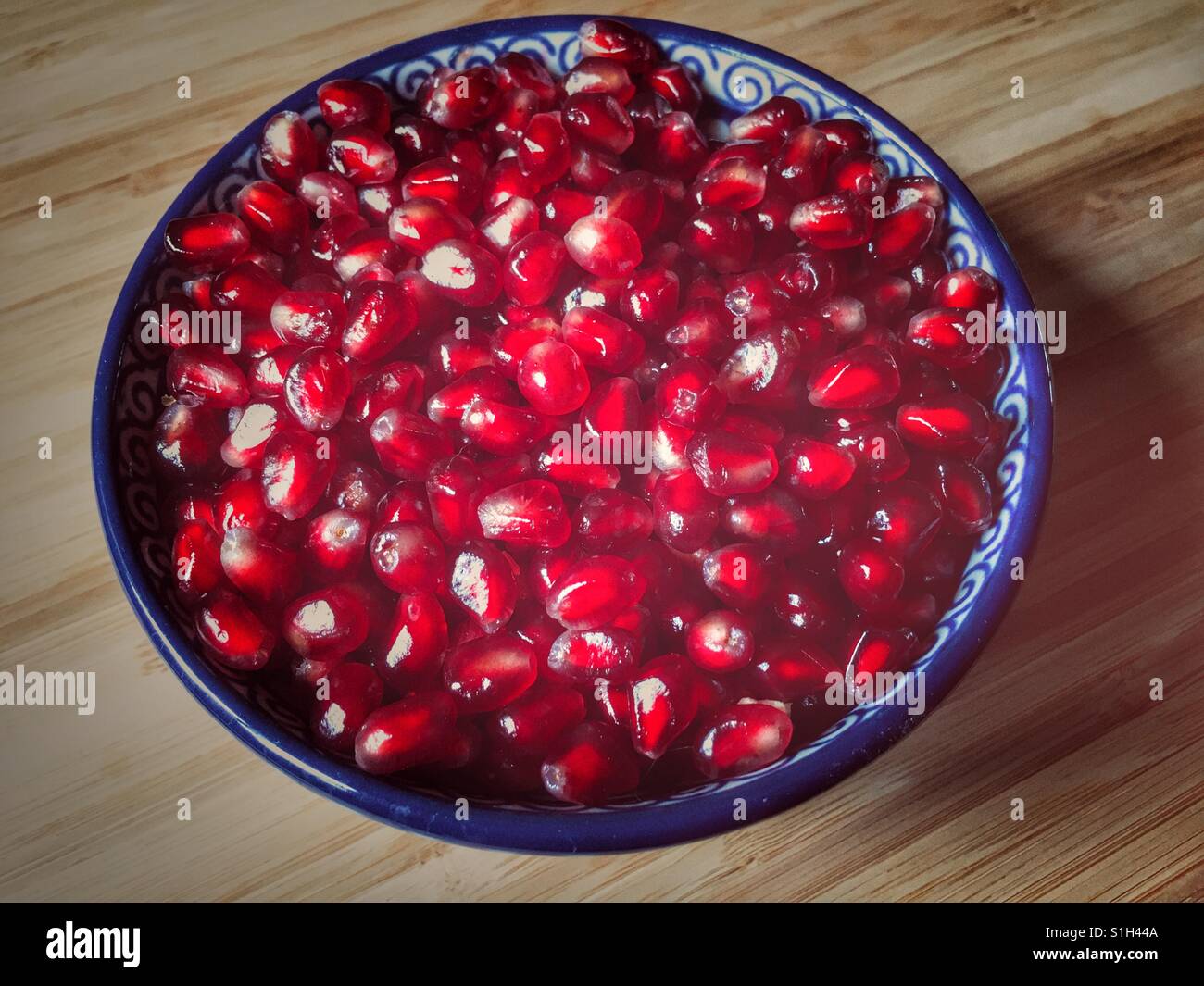 A bowl of Pomegranate arils (seeds), Punica granatum - Smartphone Captured Stock Image