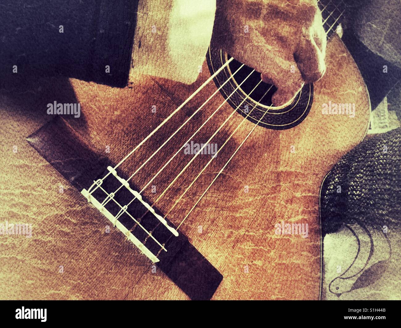 Guitarist playing a classical guitar - Smartphone Captured Stock Image