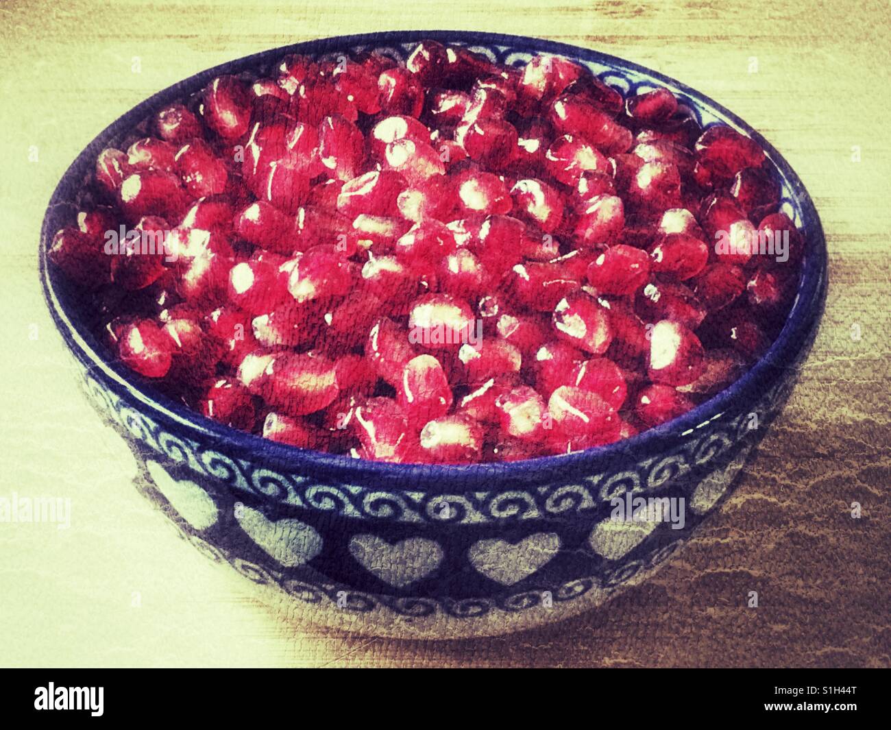 A bowl of Pomegranate arils (seeds), Punica granatum - Smartphone Captured Stock Image