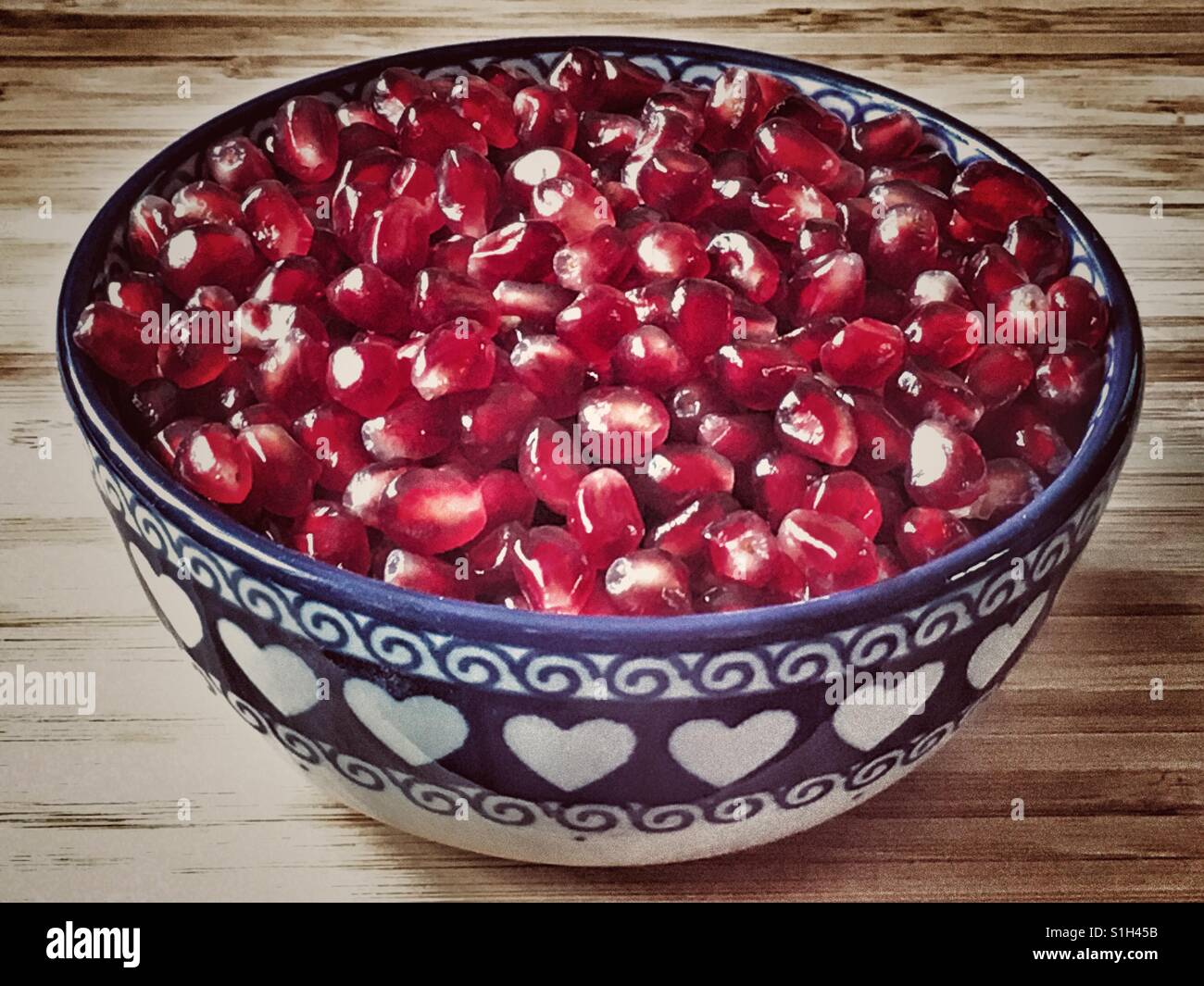 A bowl of Pomegranate arils (seeds), Punica granatum - Smartphone Captured Stock Image