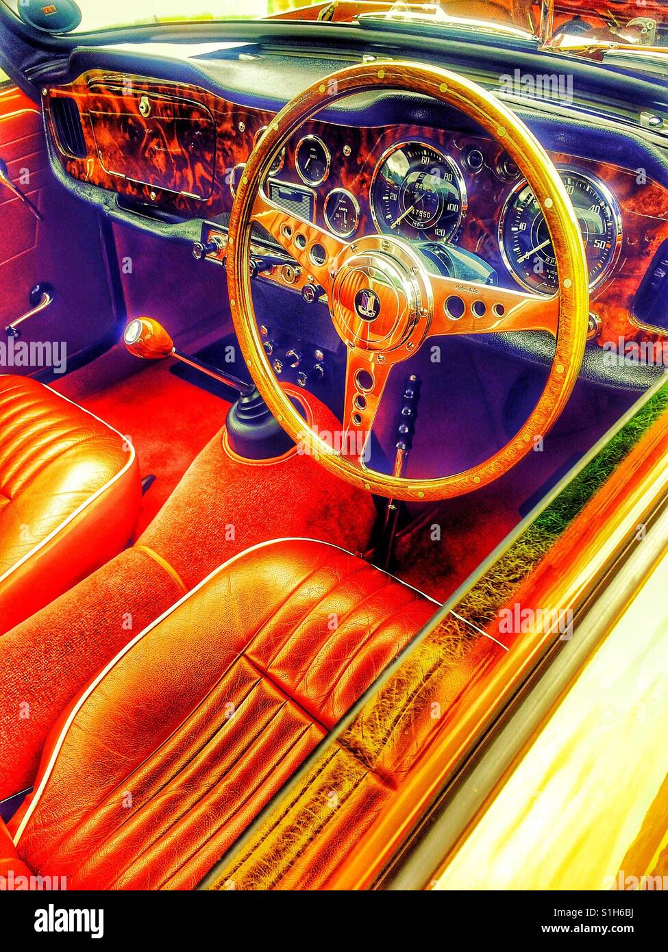 Dashboard and steering wheel of 1963 Triumph TR4 sports car - Smartphone Captured Stock Image