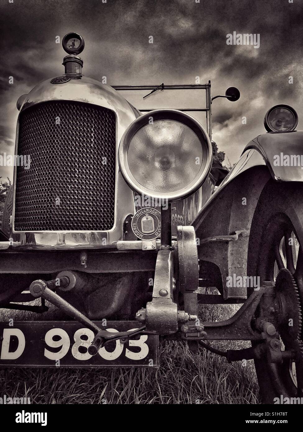 A toned monochrome low angle image of the front of a Morris Cowley Vintage Car. The vehicle is currently in the United Kingdom. Photo Credit © COLIN HOSKINS. - Smartphone Captured Stock Image