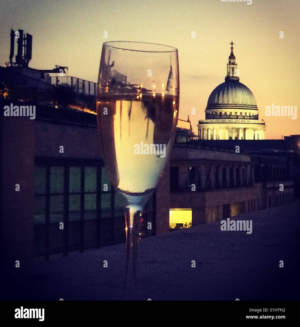 Glass of champagne on the terrace with a city view of saint pauls - Smartphone Captured Stock Image