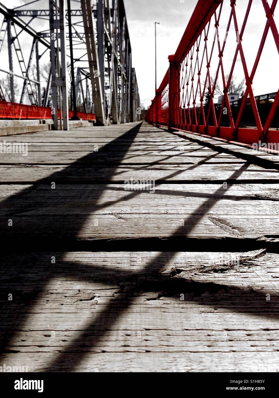 Low view of bridge in monotone and red Stock Photo