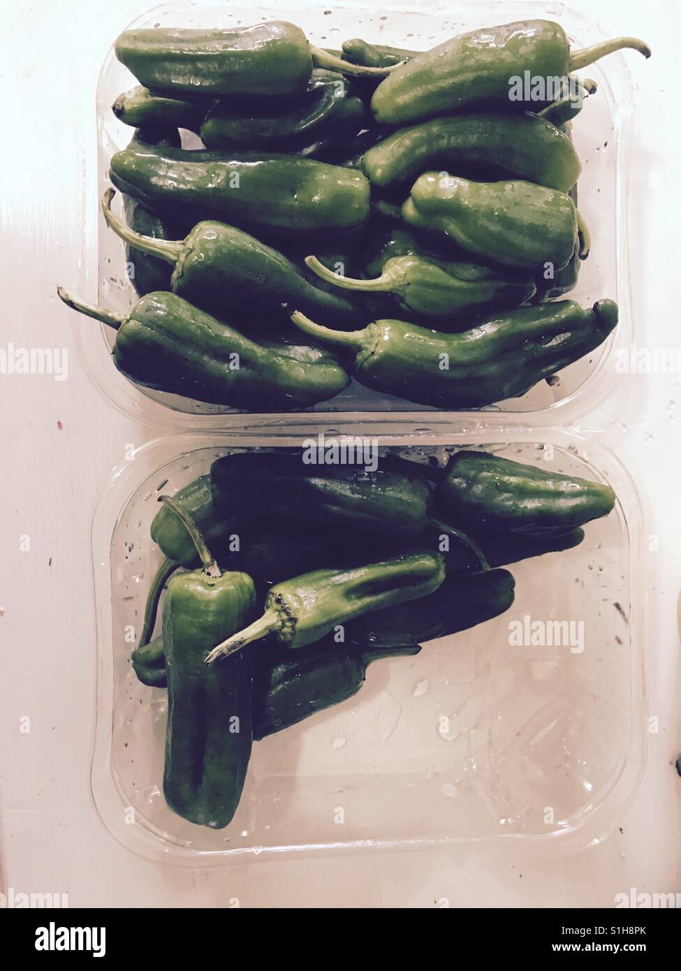 Pimientos de Padron in plastic packaging - Smartphone Captured Stock Image