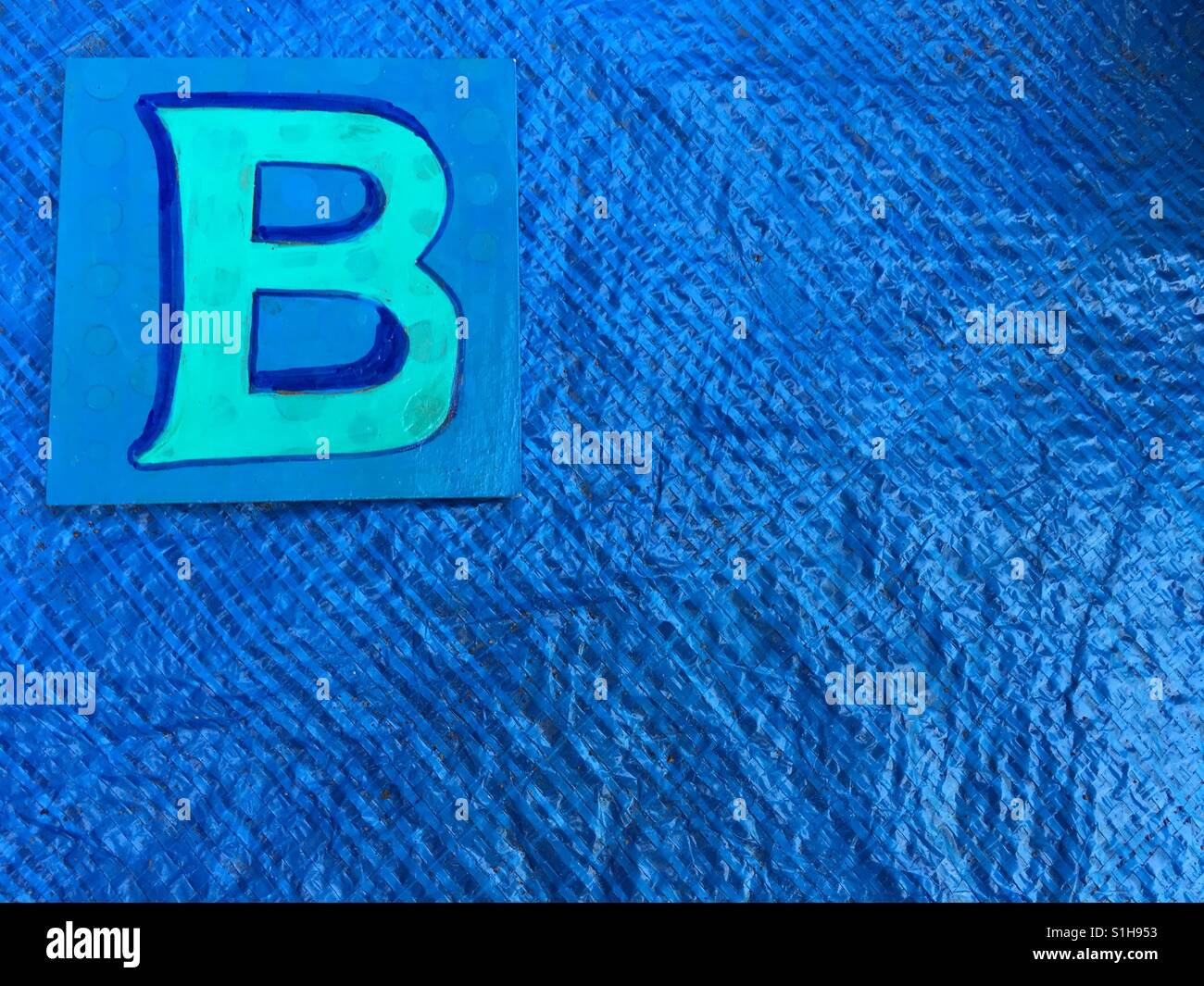 Letter B on blue background - Smartphone Captured Stock Image