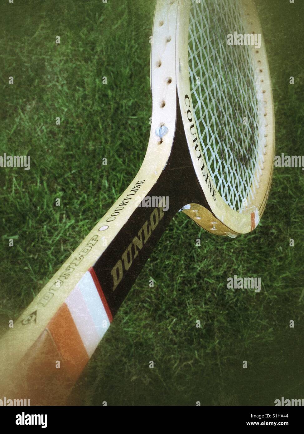 Old fashioned wooden tennis racket Stock Photo