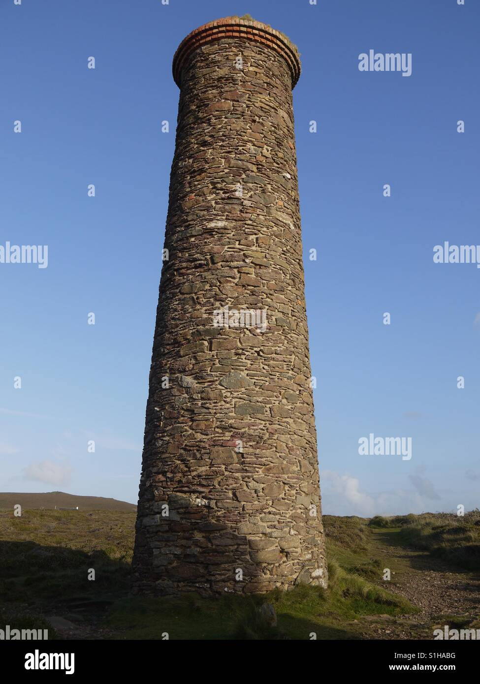 Tin mine chimney on a summers day Stock Photo